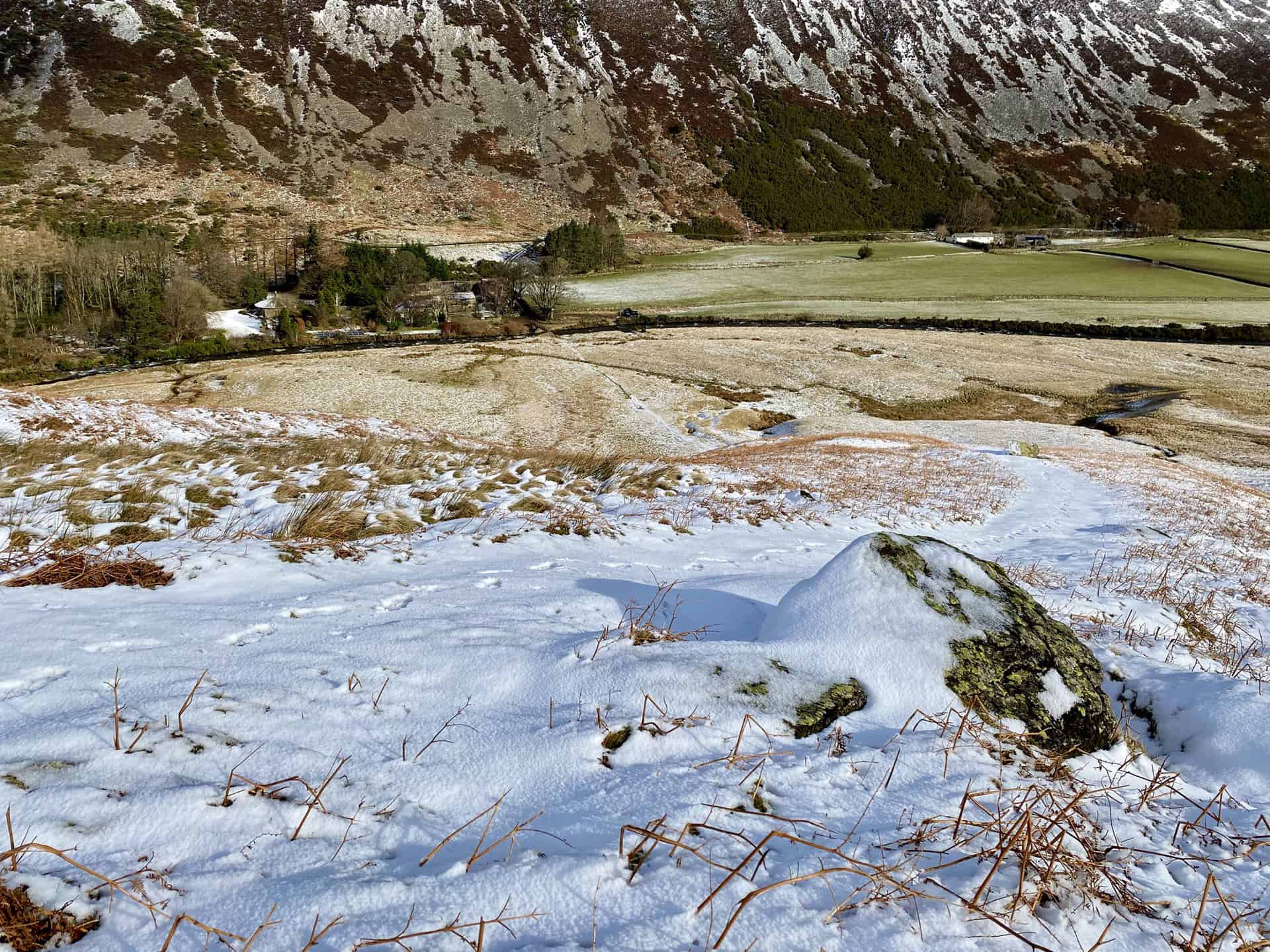 The snow-covered route down to Roundhouse, below the steep slopes of Carrock Fell.