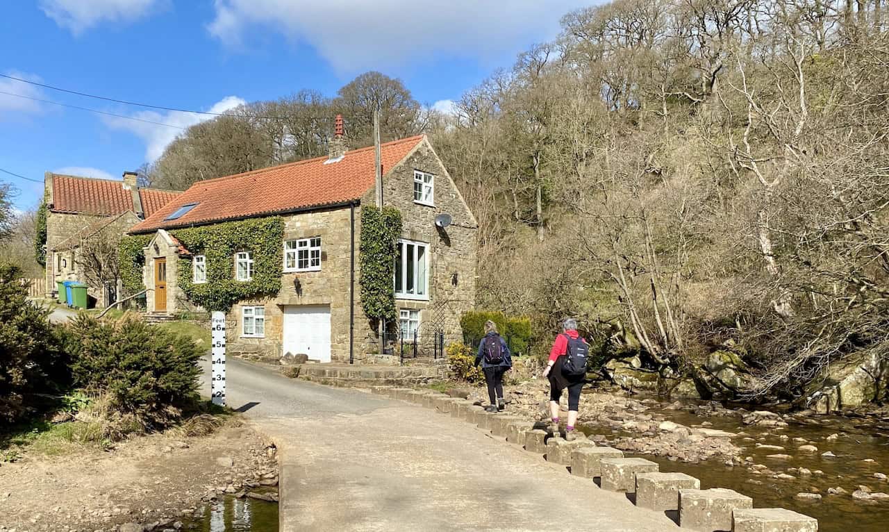 A ford and stepping stones cross Eller Beck at Darnholm, providing a charming spot for walkers. This location is a highlight of your Grosmont walk.