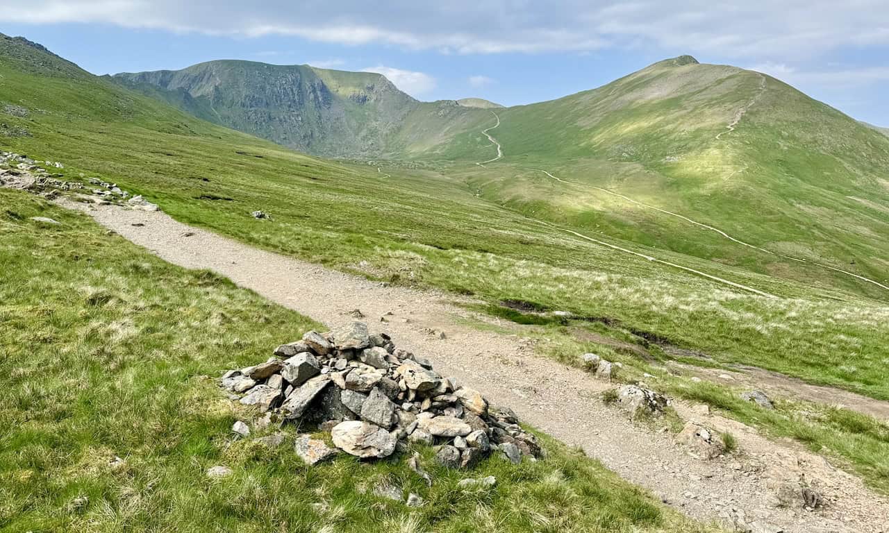 As we cross the ridge above Bleaberry Crag, Helvellyn looms directly ahead with Catstye Cam to the right. The path to Catstye Cam’s summit offers unparalleled views of Ullswater and is ideal for those aiming to reach Helvellyn via Swirral Edge.