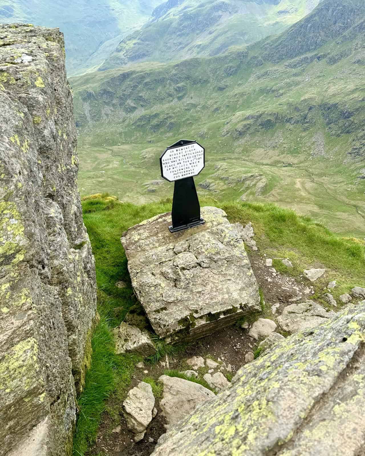 A memorial cross at High Spying How marks our traverse across Striding Edge and is a memorable part of the Helvellyn via Striding Edge walk.