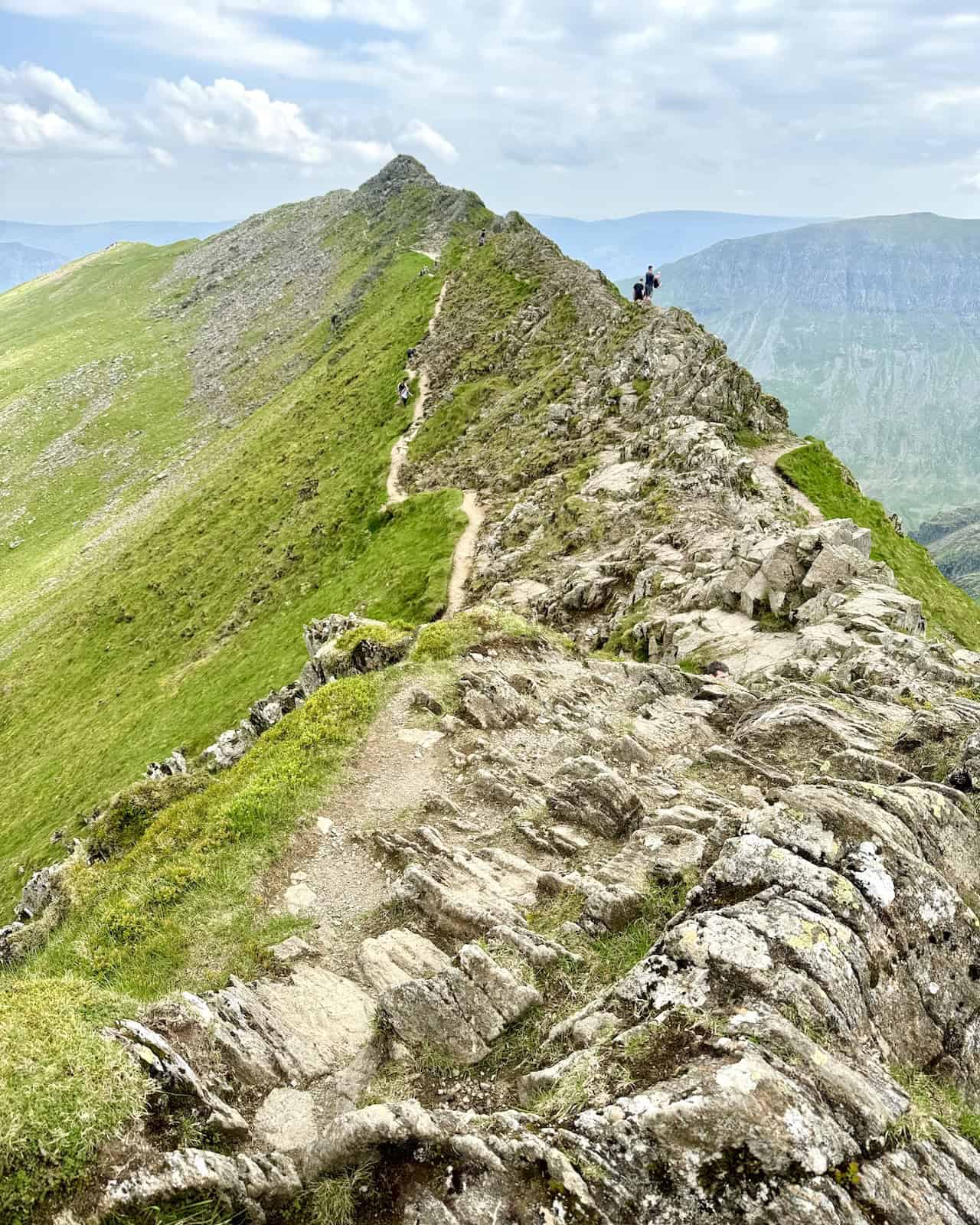 At the midpoint of Striding Edge, there is a convenient lower path for those who prefer not to cross the highest points. The diverse options make Helvellyn via Striding Edge accessible to many hikers.