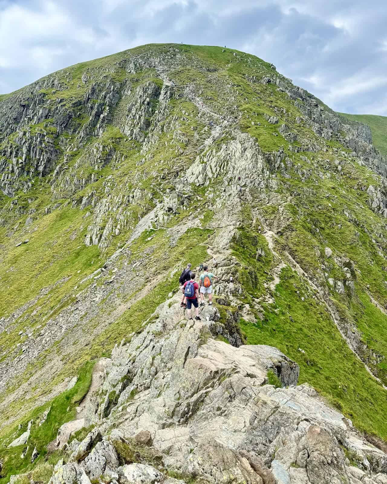 Continuing across the ridge, we look west towards the summit, part of the exhilarating Helvellyn via Striding Edge trek.