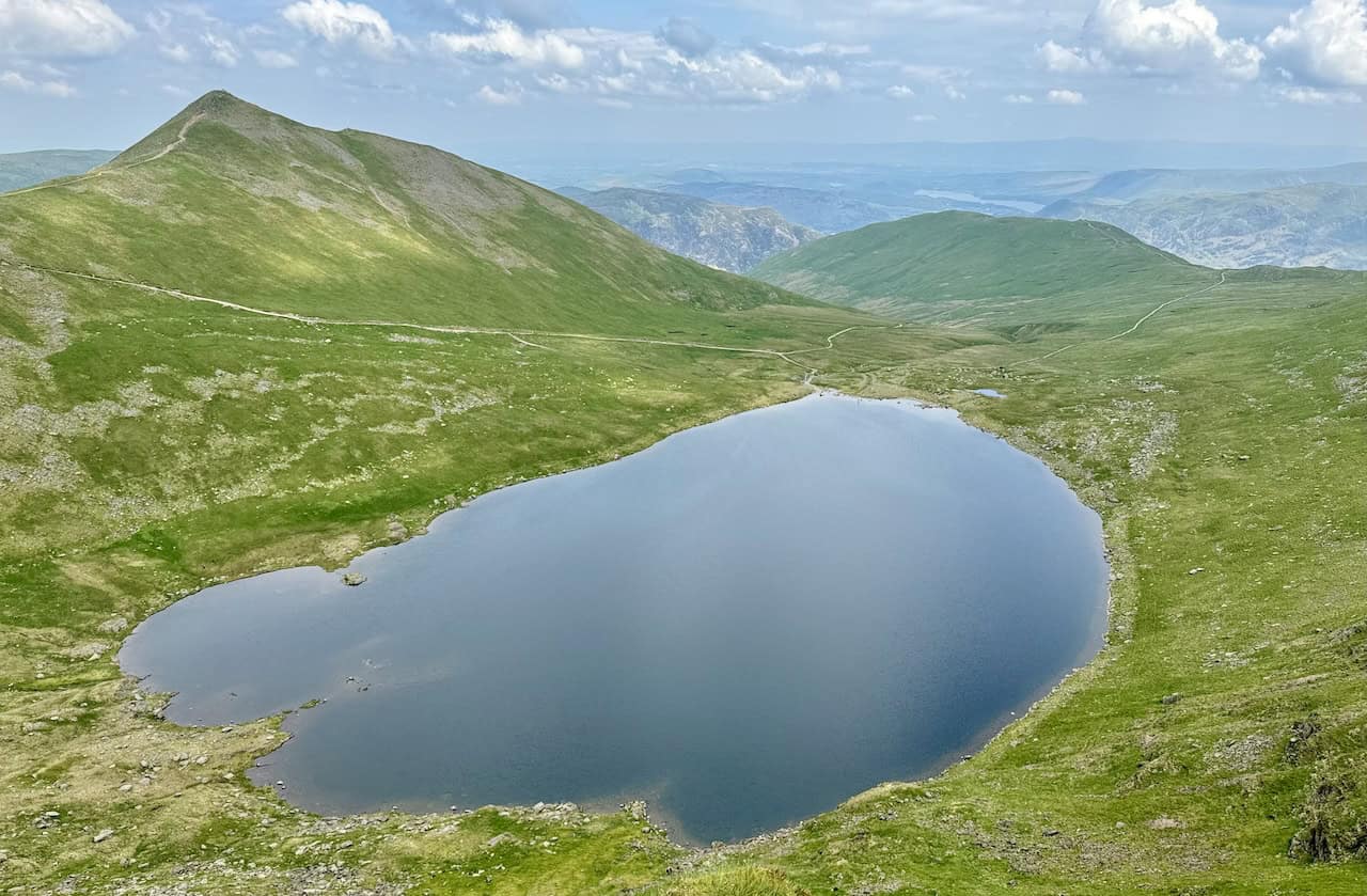 The remarkable view from Striding Edge down to Red Tarn, with Catstye Cam on the left, is simply stunning. This vantage point is a memorable part of the Helvellyn via Striding Edge experience.