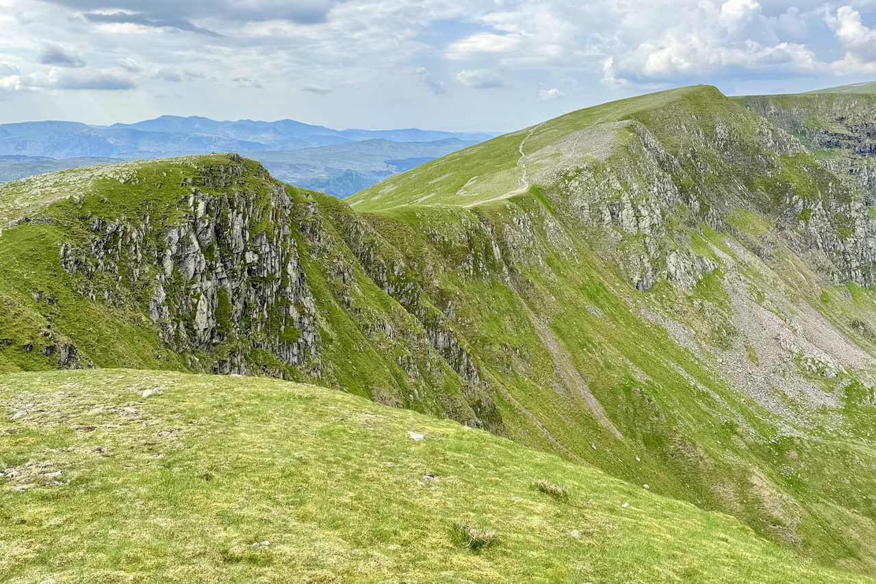 Another view north from Dollywaggon Pike features High Crag on the left and Nethermost Pike on the right, connected by visible paths. We preferred sticking close to the eastern edge for better views. This section from Helvellyn to Dollywaggon Pike offers lovely, comfortable walking.