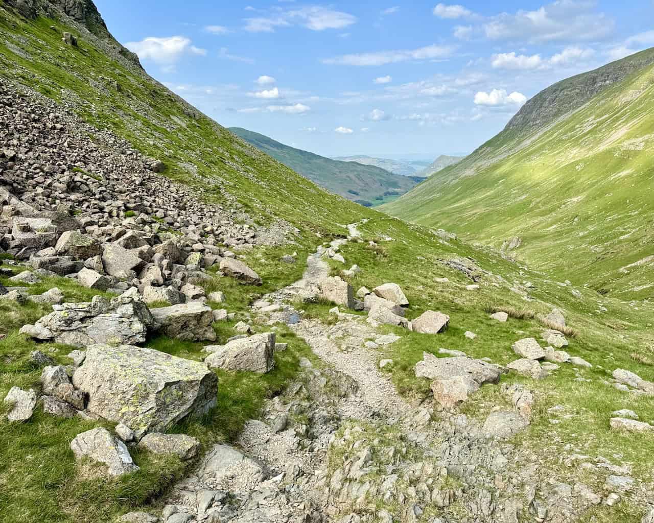The start of the four-mile (6.4-kilometre) route from Grisedale Tarn through the valley to Patterdale is picturesque and inviting.