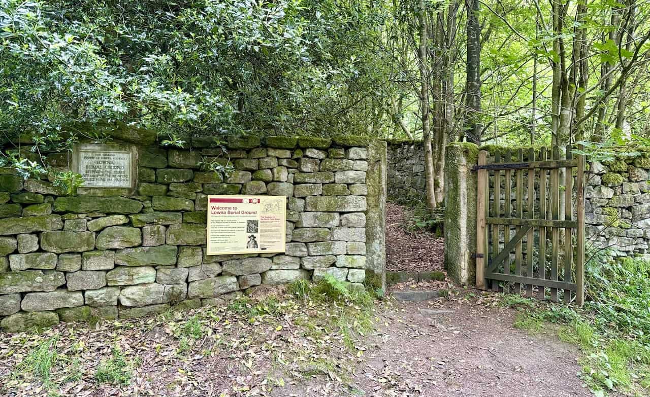 Entrance to the Quaker Burial Ground with an old, weathered plaque dedicated to the Lowna Burial Ground.

