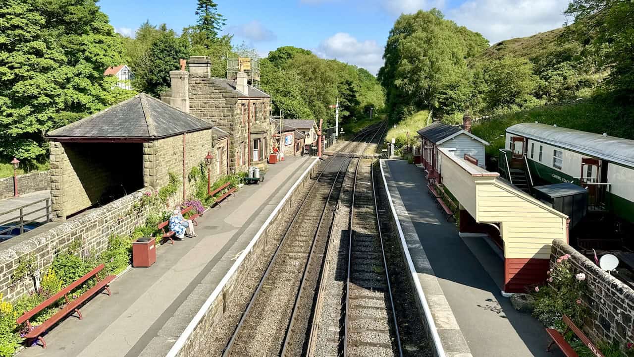 Goathland Railway Station, viewed from the footbridge crossing the railway line. The station opened on 1 July 1865 and is part of the North Yorkshire Moors Railway. It features in TV shows and films, including Harry Potter and Heartbeat. A highlight of the Goathland walk.
