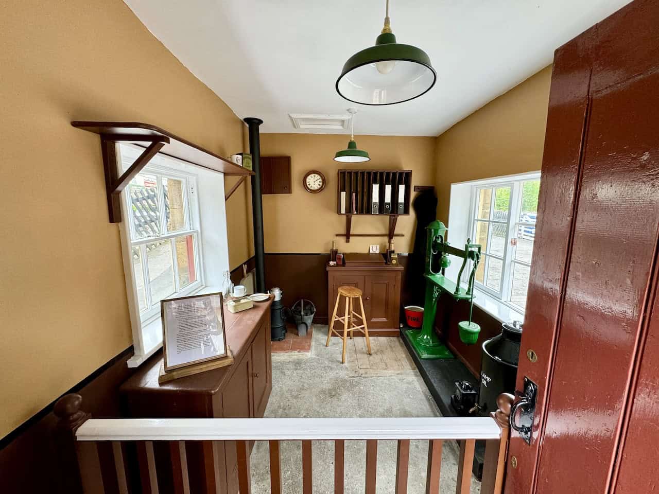 Restored weighbridge office built as part of the original station in 1865. It has served multiple purposes over the years, including a station shop and ticket office. Restoration started in 2019 to depict the office as it might have looked around 1922.