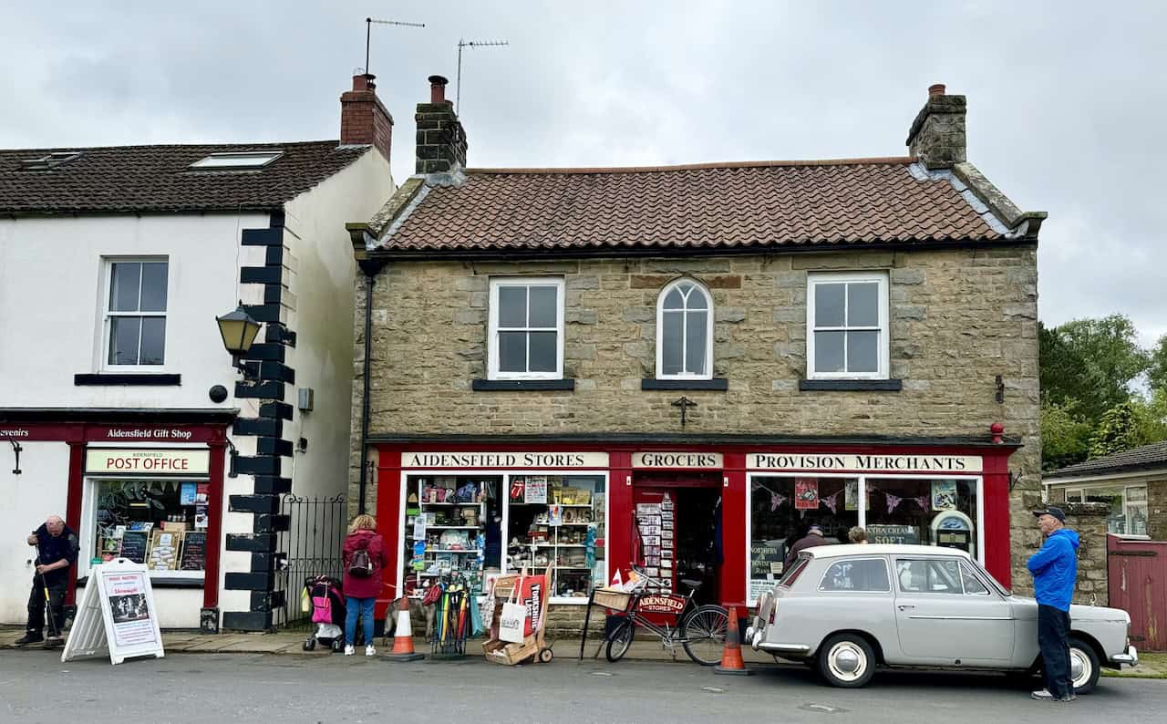 Aidensfield Stores with its distinctive red and cream exterior, known for its role in Heartbeat. The store stocks a huge variety of memorabilia for fans of the show on the Goathland to Grosmont walk.