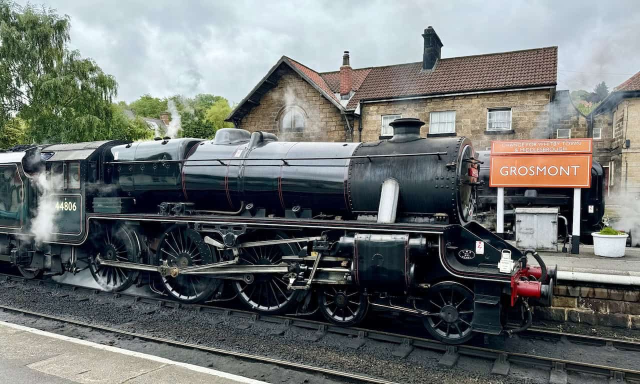 Steam locomotive 44806, known as 'Kenneth Aldcroft,' at Grosmont Railway Station. Built in 1944, the locomotive has a rich history and was overhauled to ensure its continued operation.