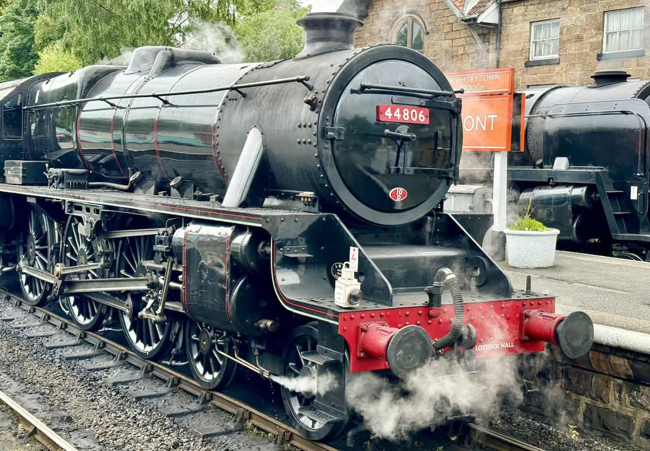 Steam locomotive 44806, known as 'Kenneth Aldcroft,' at Grosmont Railway Station. Built in 1944, the locomotive has a rich history and was overhauled to ensure its continued operation.