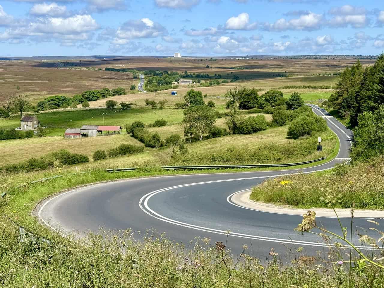 Overlooking the bend in the road of the A169, with the pyramidal shape of the radar station at RAF Fylingdales visible on the horizon.