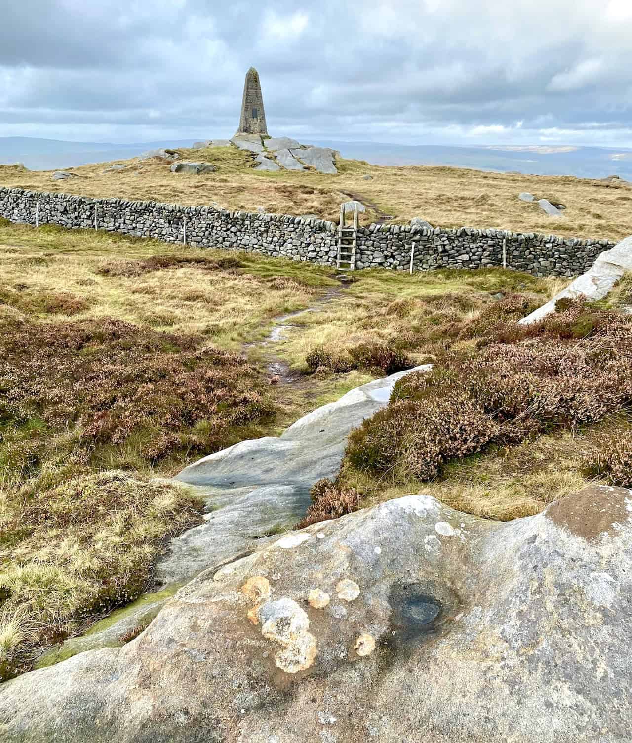 Cracoe War Memorial on the summit of Cracoe Fell, standing 7.2 metres high and overlooking the villages of Cracoe and Rylstone.