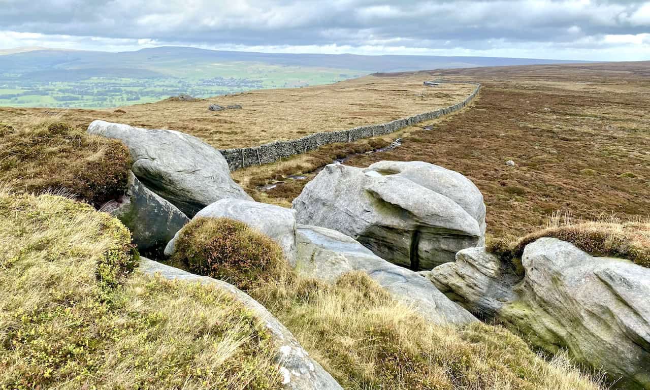 The Cracoe War Memorial obelisk coming into view while following the wall south from Rolling Gate Crags, about halfway through the Barden Moor walk.