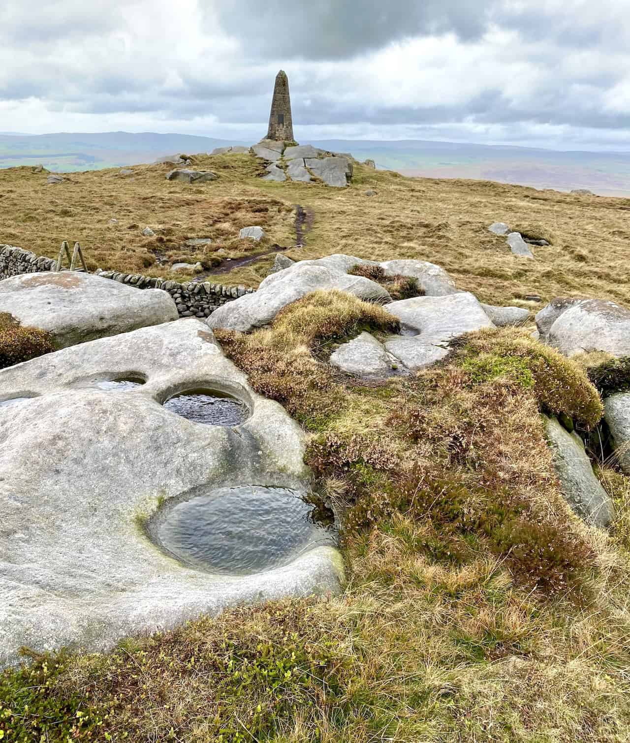 Cracoe War Memorial on the summit of Cracoe Fell, standing 7.2 metres high and overlooking the villages of Cracoe and Rylstone.