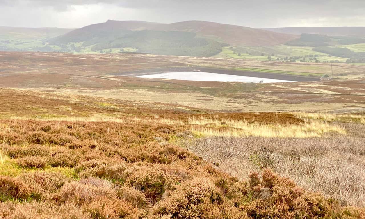 View of Lower Barden Reservoir from Hutchen Gill Head near the end of the Barden Moor walk, with Simon’s Seat visible on the horizon.