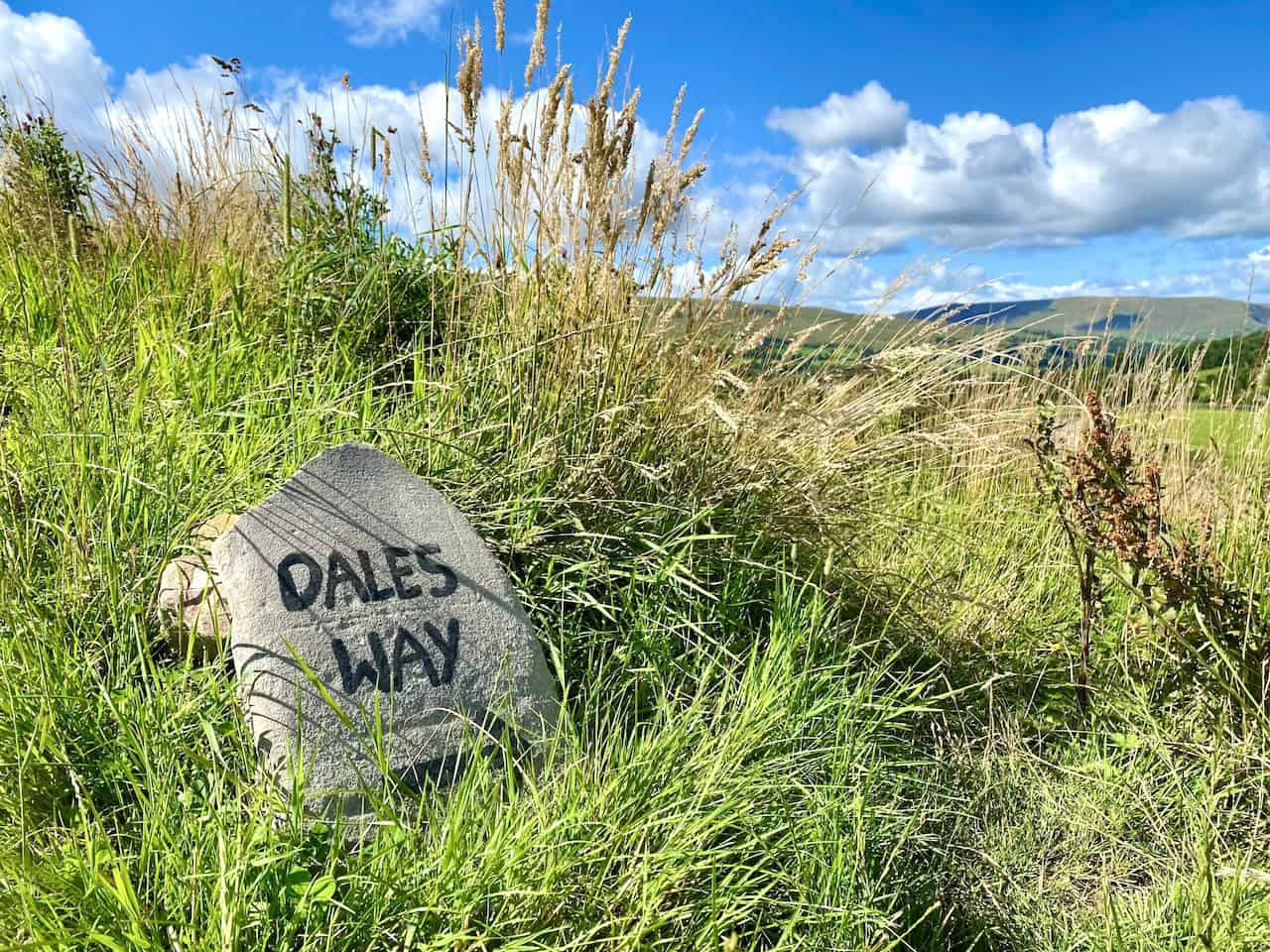 A well-marked signpost on the Dales Way, guiding walkers from Cowgill to Laithbank through the beautiful Dentdale valley.