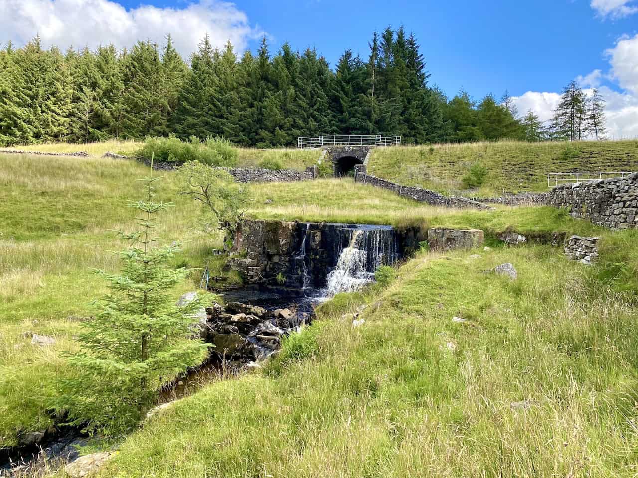 A tranquil waterfall near Hazel Bottom, just south of Dent Head Farm, adding to the peaceful atmosphere of the Dentdale walk.