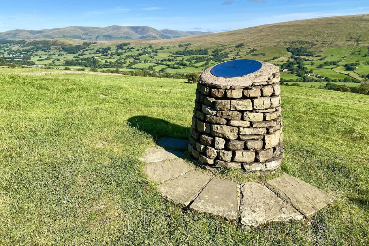 A toposcope at the top of Flinter Gill ravine, offering panoramic views of the surrounding landscape, including peaks in the Howgill Fells.