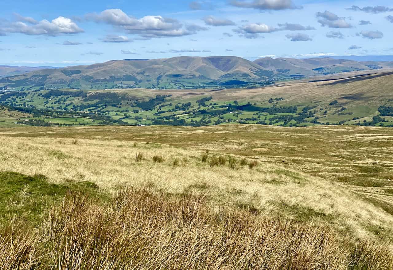 Sweeping views from the slopes of Great Coum towards the north-west, showcasing the Howgill Fells on the horizon.