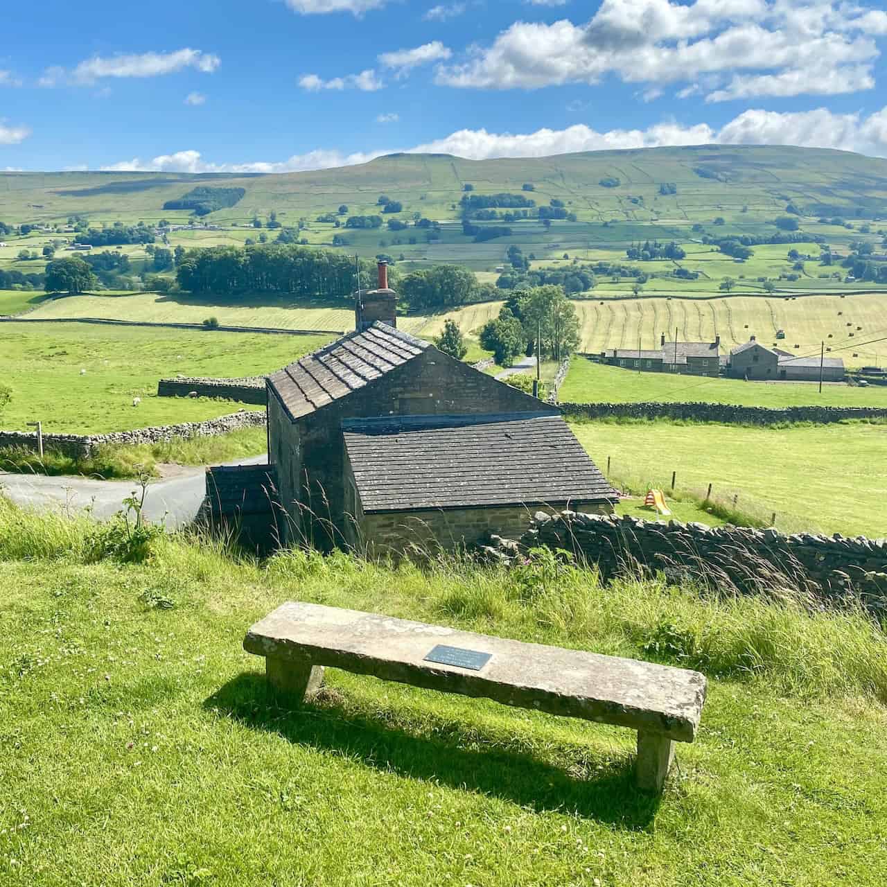 View south from Sedbusk across Wensleydale to Yorburgh while I sit on a stone bench and enjoy tea from my flask.