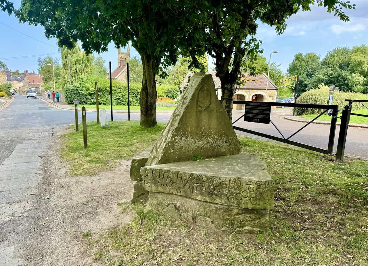 The Cleveland Way stone monument at the end of the Helmsley to Rievaulx Abbey walk, listing key locations along the trail.