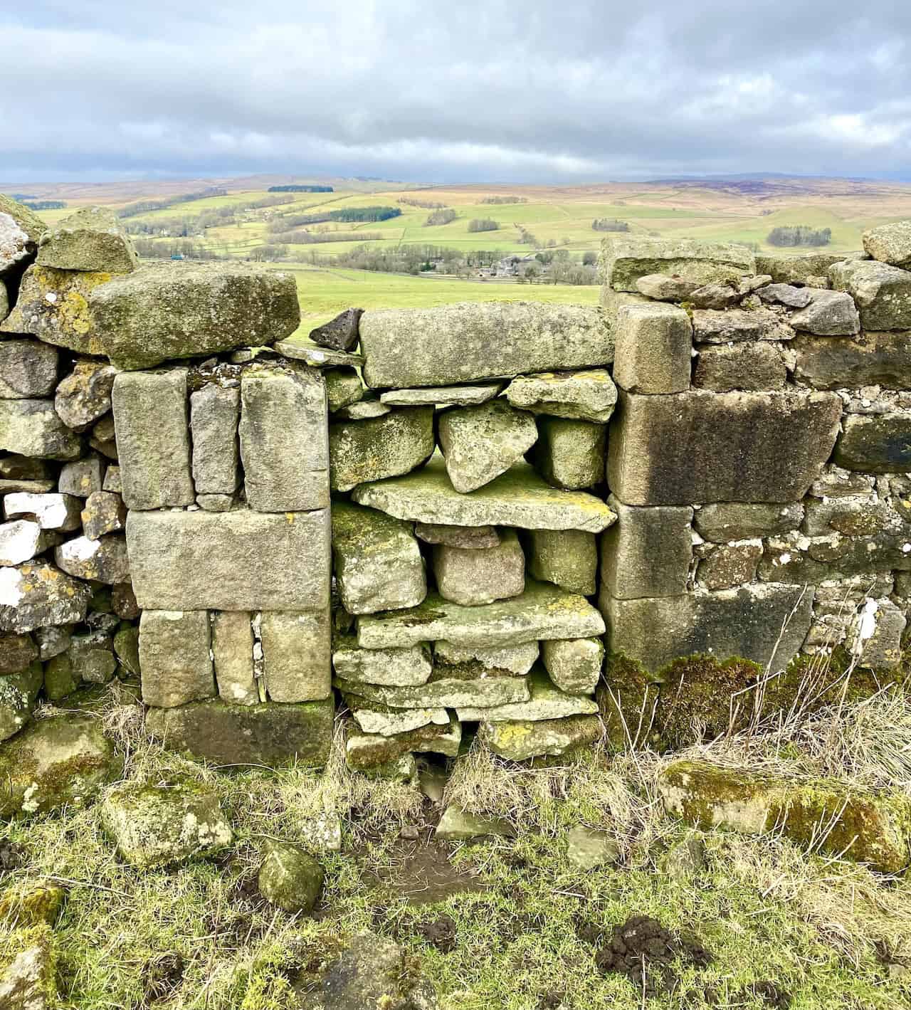 A neatly closed gap in a dry stone wall on Fell Side Laithe, showcasing traditional craftsmanship.