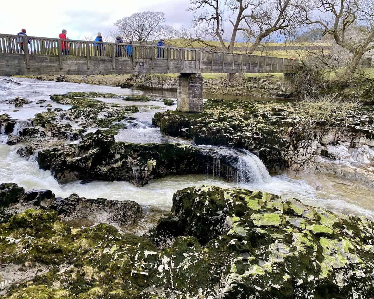 Linton Falls, the largest waterfall on the River Wharfe, with dramatic limestone outcrops and scenic walking trails nearby.