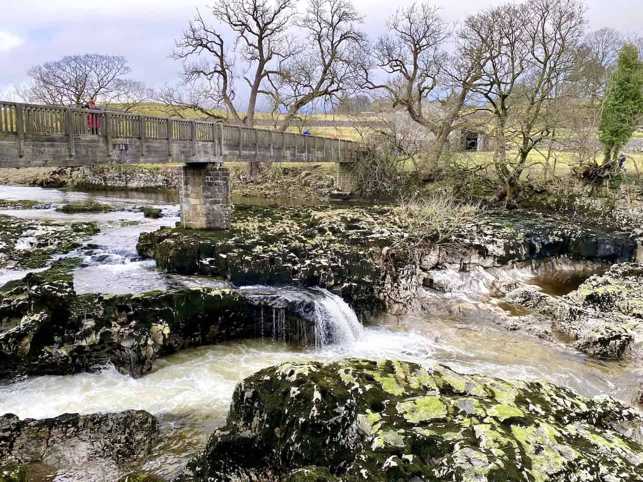 Linton Falls, the largest waterfall on the River Wharfe, with dramatic limestone outcrops and scenic walking trails nearby.