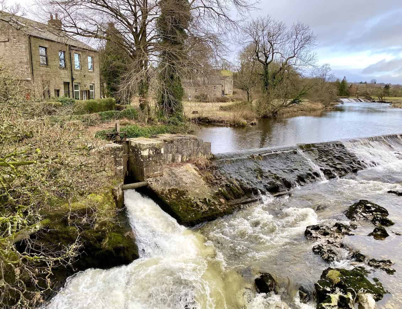 Linton Falls, the largest waterfall on the River Wharfe, with dramatic limestone outcrops and scenic walking trails nearby. A key stop on our Linton walk.