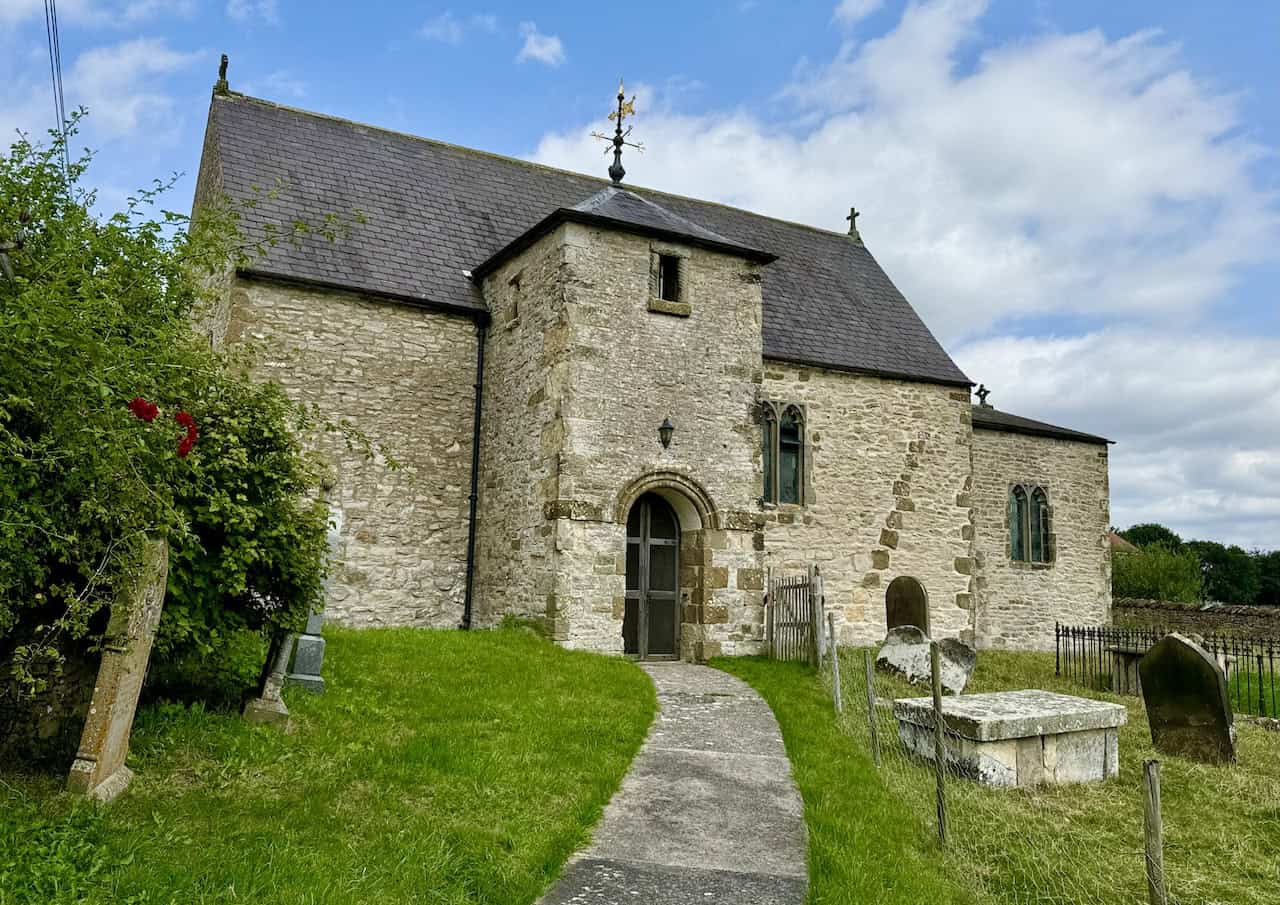 All Saints Church in Old Byland, a historic Grade I listed building with Norman and Saxon features.
