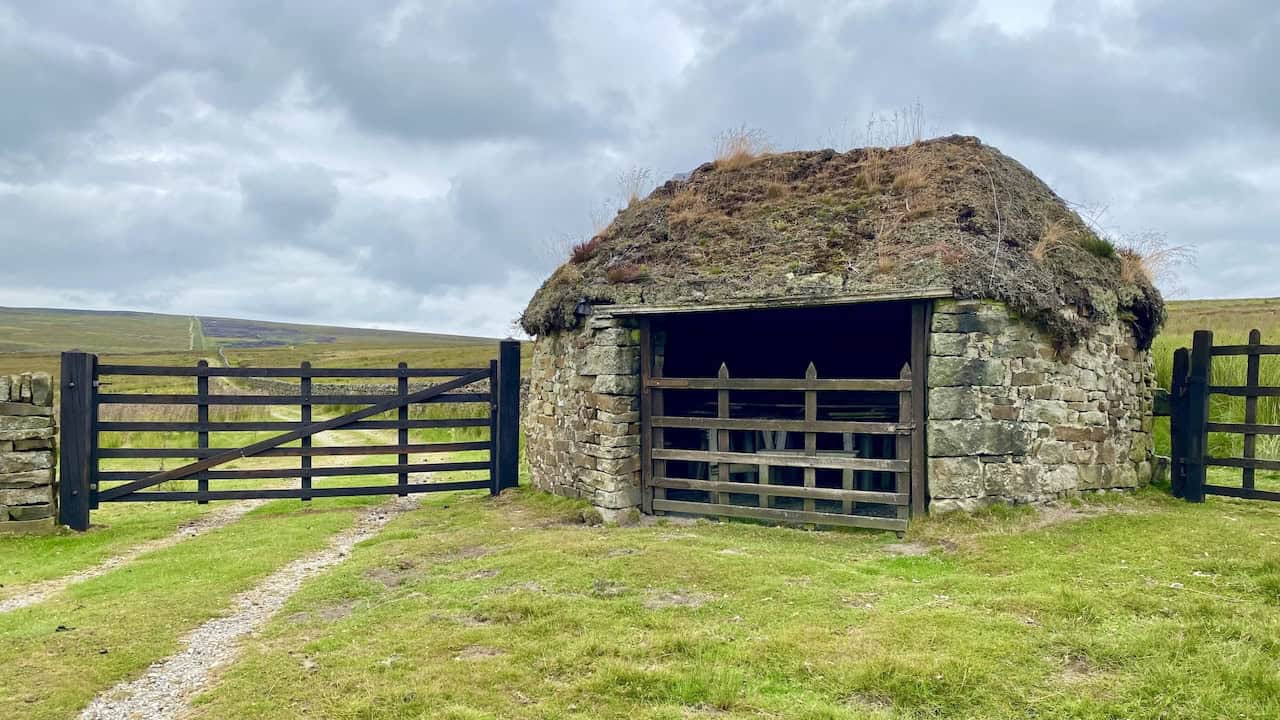 Further along, a rustic shooting lodge emerges near the crossing of White Wham Beck, adding to the charm of this section of our trek.