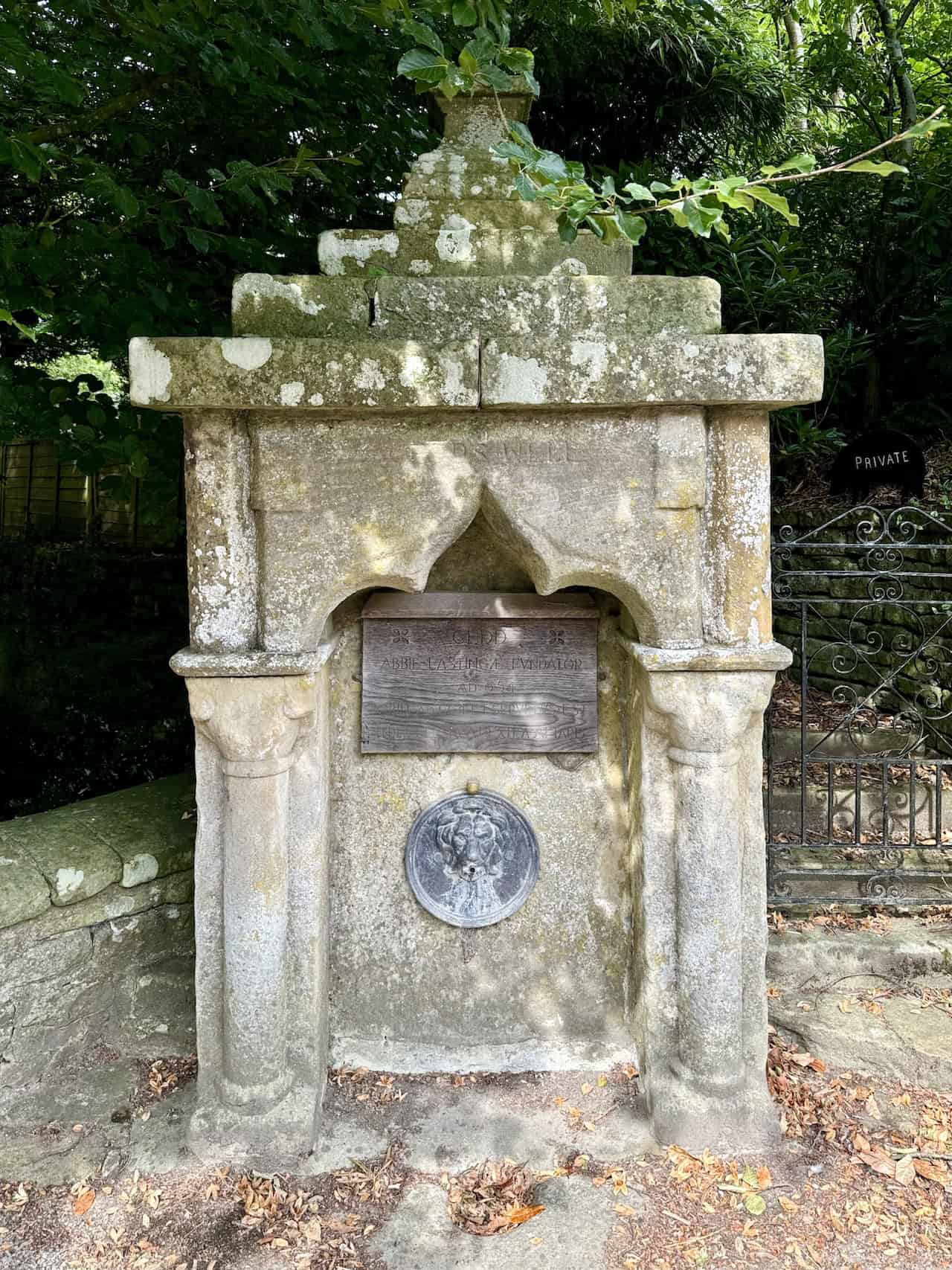 St Cedd’s Well in Lastingham with a wooden plaque commemorating St Cedd.
