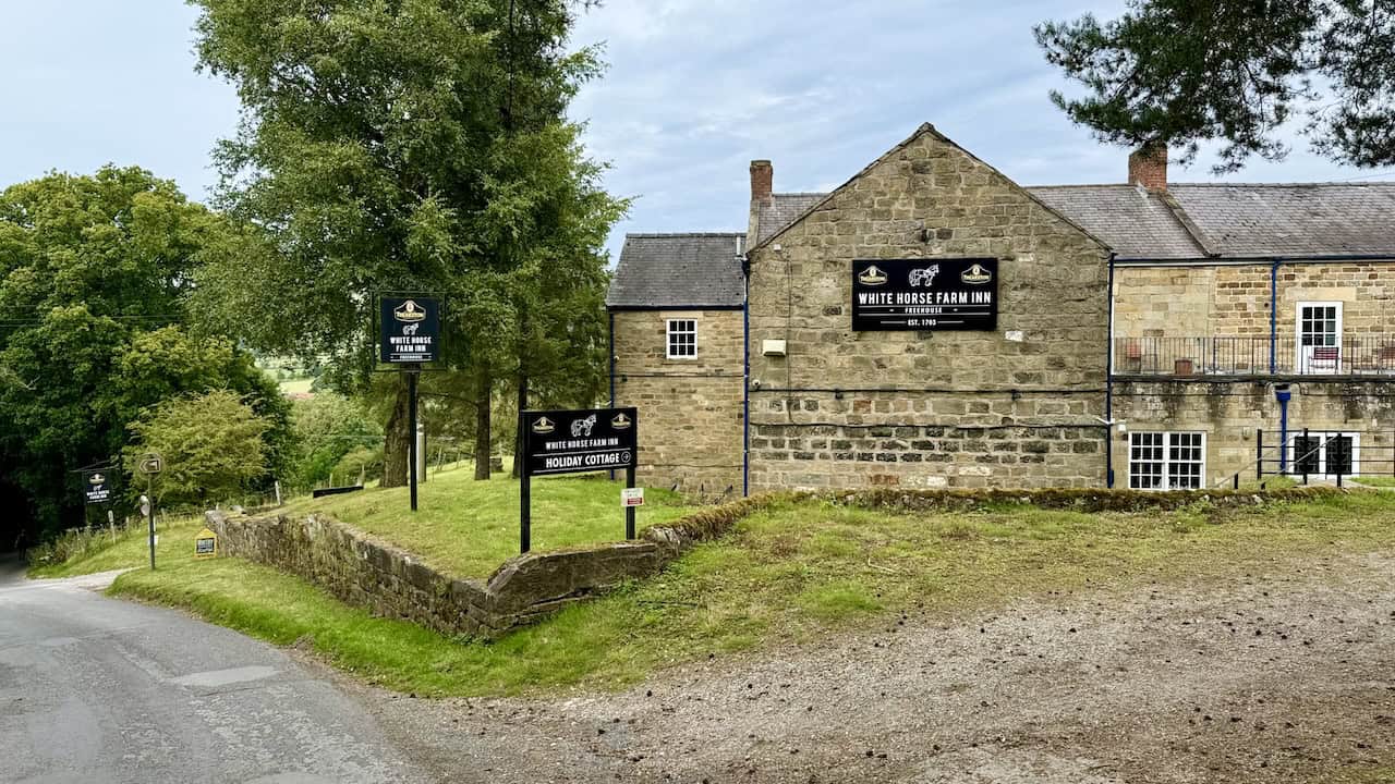 Passing the White Horse Farm Inn on Gill Lane, completing the Rosedale Abbey walk.
